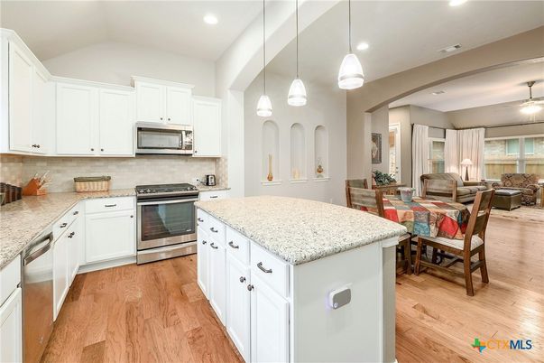 Dining room, Interior, Kitchen, Living room, Pendant Lights, Recessed Lighting, Stainless Steel Appliances, Wood Texture Flooring
