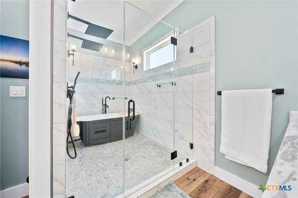Bathroom, Glass Shower, Interior, Marble Walls, Wood Texture Flooring