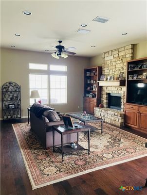 Fireplace, Interior, Living room, Recessed Lighting, Stone Walls, Wood Texture Flooring
