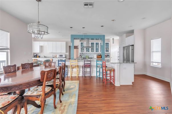 Dining room, Interior, Kitchen, Pendant Lights, Recessed Lighting, Stainless Steel Appliances, Wood Texture Flooring