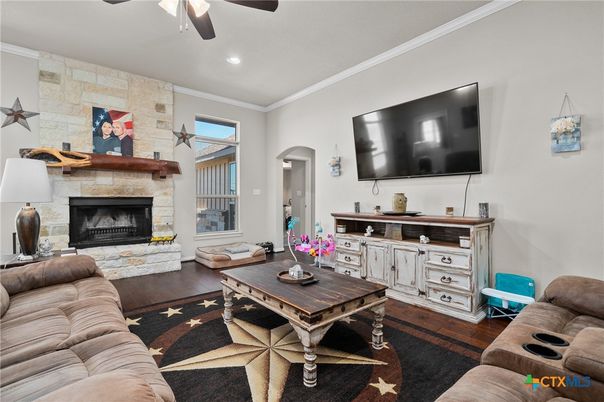 Fireplace, Interior, Living room, Recessed Lighting, Stone Walls, Wood Texture Flooring