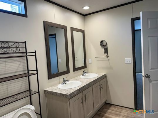 Bathroom, Dual Sink Vanities, Interior, Recessed Lighting, Wood Texture Flooring