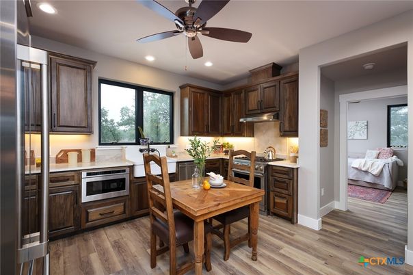 Dining room, Interior, Kitchen, Recessed Lighting, Stainless Steel Appliances, Wood Texture Flooring