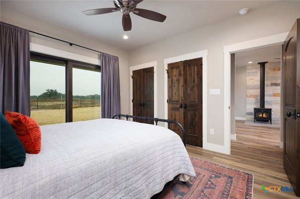 Bedroom, Fireplace, Interior, Recessed Lighting, Stone Walls, Wood Texture Flooring