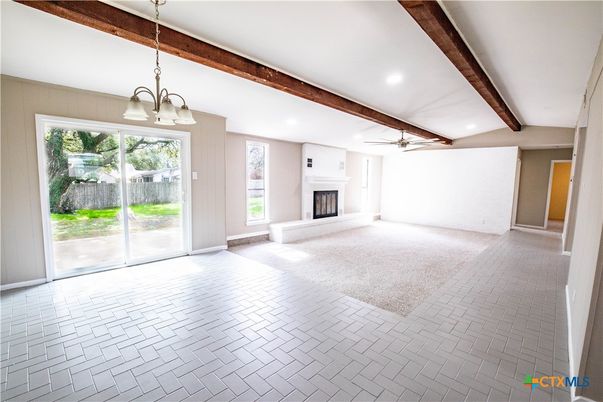 Chandelier, Empty room, Fireplace, Interior, Recessed Lighting, Wooden Beams