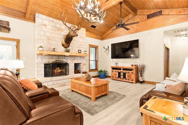 Chandelier, Fireplace, Interior, Living room, Stone Walls, Wooden Beams, Wooden Ceilings, Wood Texture Flooring