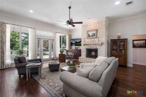 Fireplace, Interior, Living room, Recessed Lighting, Stone Walls, Wood Texture Flooring