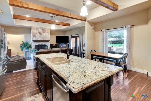 Dining room, Fireplace, Interior, Kitchen, Pendant Lights, Recessed Lighting, Wooden Beams, Wood Texture Flooring