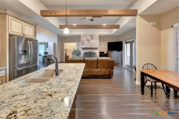 Fireplace, Interior, Kitchen, Living room, Pendant Lights, Recessed Lighting, Stone Walls, Wooden Beams, Wood Texture Flooring