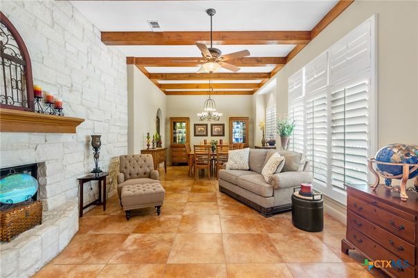 Chandelier, Dining room, Fireplace, Interior, Living room, Stone Walls, Wooden Beams