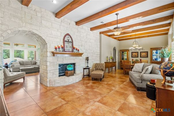 Chandelier, Fireplace, Interior, Living room, Recessed Lighting, Stone Walls, Wooden Beams