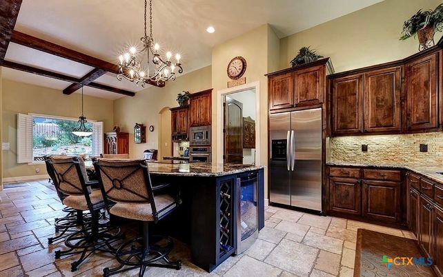 Chandelier, Dining room, Interior, Kitchen, Pendant Lights, Recessed Lighting, Stainless Steel Appliances, Wooden Beams