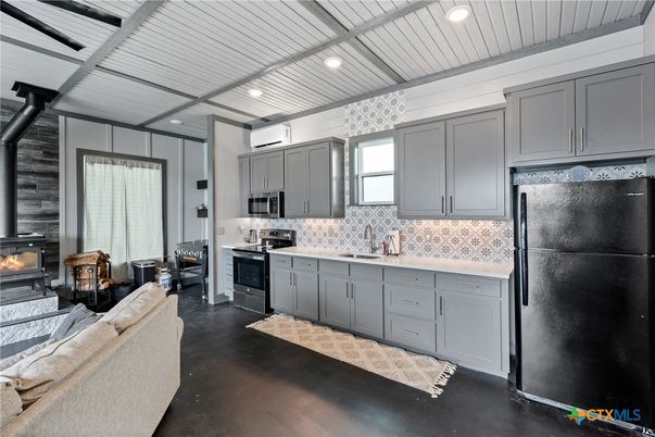 Fireplace, Interior, Kitchen, Living room, Recessed Lighting, Stainless Steel Appliances