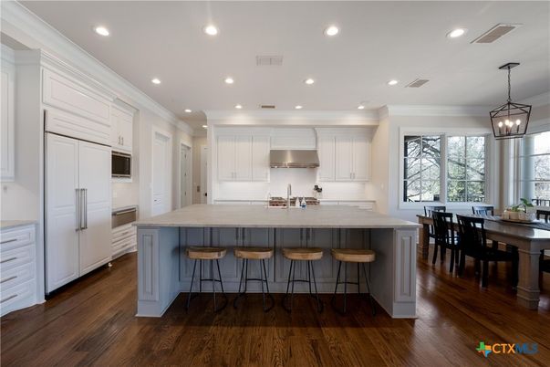 Dining room, Interior, Kitchen, Pendant Lights, Recessed Lighting, Stainless Steel Appliances, Wood Texture Flooring