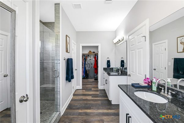Bathroom, Dual Sink Vanities, Glass Shower, Interior, Wood Texture Flooring