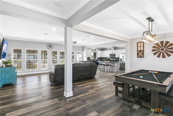 Billiard Table, Game Room, Interior, Kitchen, Living room, Pendant Lights, Recessed Lighting, Stainless Steel Appliances, Wood Texture Flooring