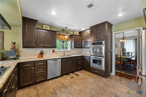 Dining room, Interior, Kitchen, Pendant Lights, Recessed Lighting, Stainless Steel Appliances, Wood Texture Flooring
