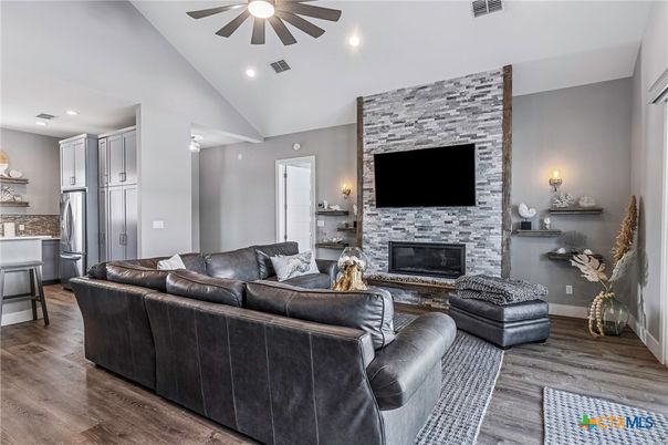 Fireplace, Interior, Kitchen, Living room, Recessed Lighting, Stone Walls, Wood Texture Flooring