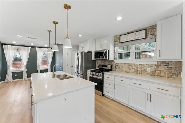 Interior, Kitchen, Pendant Lights, Recessed Lighting, Stainless Steel Appliances, Wood Texture Flooring