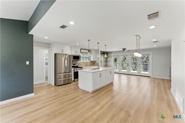 Interior, Kitchen, Pendant Lights, Recessed Lighting, Stainless Steel Appliances, Wood Texture Flooring