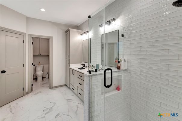 Bathroom, Dual Sink Vanities, Glass Shower, Interior, Marble, Recessed Lighting