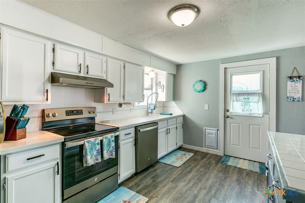 Interior, Kitchen, Tile Countertops, Wood Texture Flooring