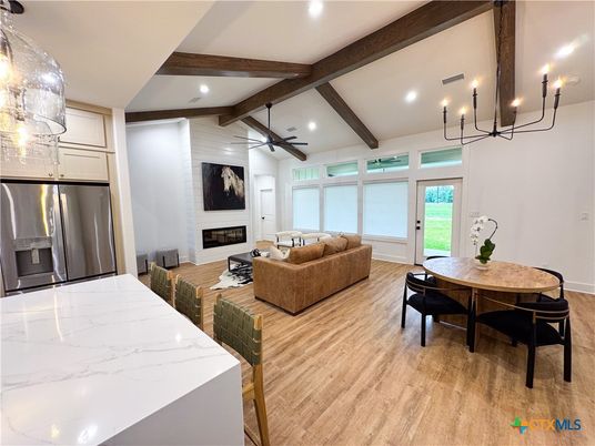 Chandelier, Dining room, Fireplace, Interior, Kitchen, Living room, Recessed Lighting, Stainless Steel Appliances, Wooden Beams, Wood Texture Flooring