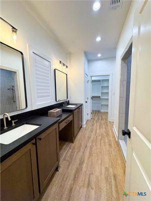 Bathroom, Dual Sink Vanities, Interior, Recessed Lighting, Wood Texture Flooring