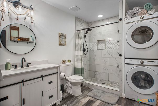 Bathroom, Glass Shower, Interior, Marble Walls, Recessed Lighting, Wood Texture Flooring