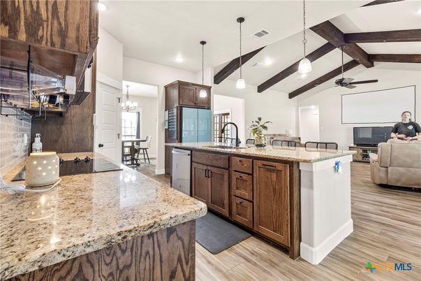 Chandelier, Dining room, Interior, Kitchen, Living room, Pendant Lights, Recessed Lighting, Wooden Beams, Wood Texture Flooring