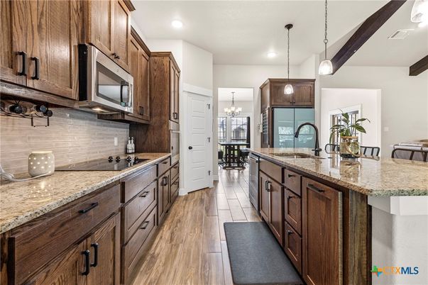Chandelier, Dining room, Interior, Kitchen, Pendant Lights, Recessed Lighting, Stainless Steel Appliances, Wood Texture Flooring