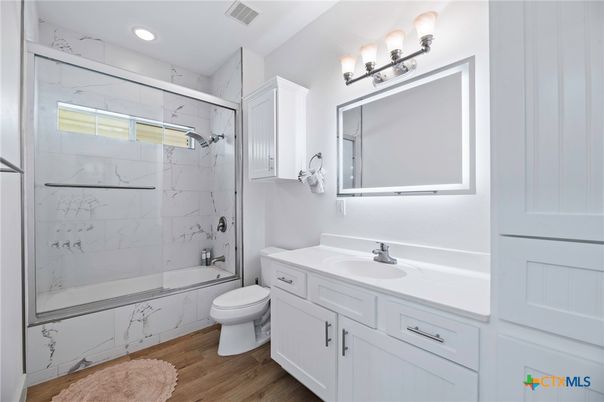 Bathroom, Glass Shower, Interior, Marble Walls, Recessed Lighting, Wood Texture Flooring