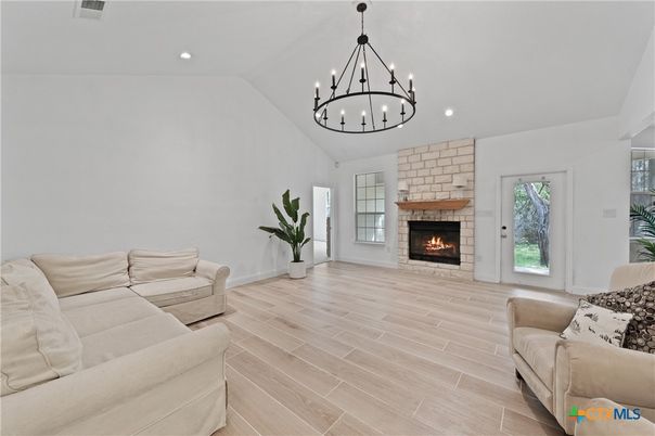 Chandelier, Fireplace, Interior, Living room, Pendant Lights, Recessed Lighting, Wood Texture Flooring