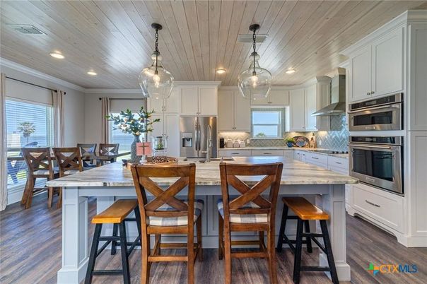 Dining room, Interior, Kitchen, Pendant Lights, Recessed Lighting, Stainless Steel Appliances, Wooden Ceilings, Wood Texture Flooring