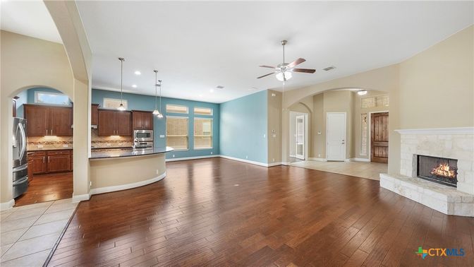 Empty room, Fireplace, Interior, Kitchen, Pendant Lights, Recessed Lighting, Wood Texture Flooring