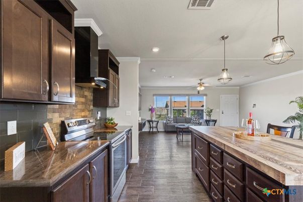 Dining room, Interior, Kitchen, Living room, Pendant Lights, Recessed Lighting, Stainless Steel Appliances, Wood Texture Flooring
