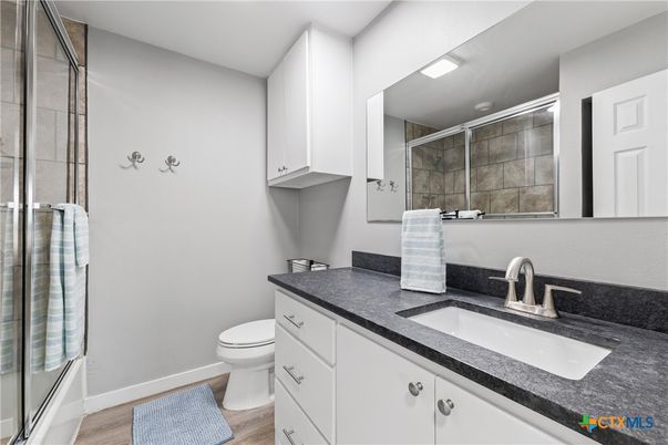 Bathroom, Dual Sink Vanities, Glass Shower, Interior, Wood Texture Flooring