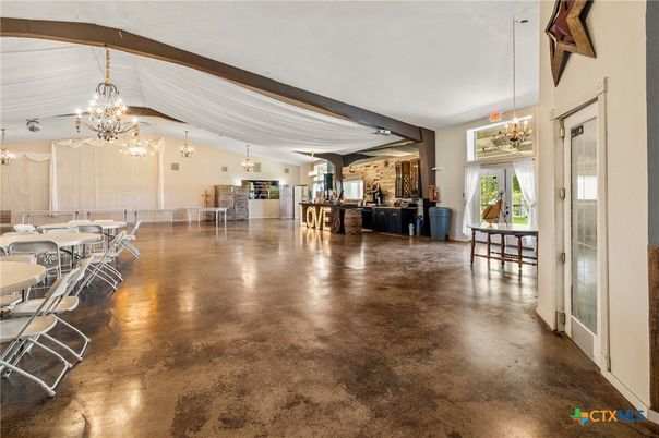 Chandelier, Dining room, Empty room, Fireplace, Interior, Pendant Lights, Stone Walls