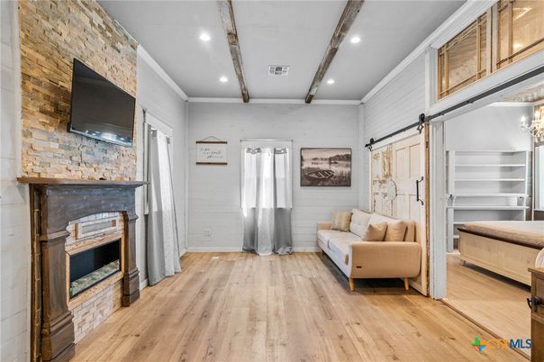 Chandelier, Fireplace, Interior, Recessed Lighting, Stone Walls, Wooden Beams, Wood Texture Flooring