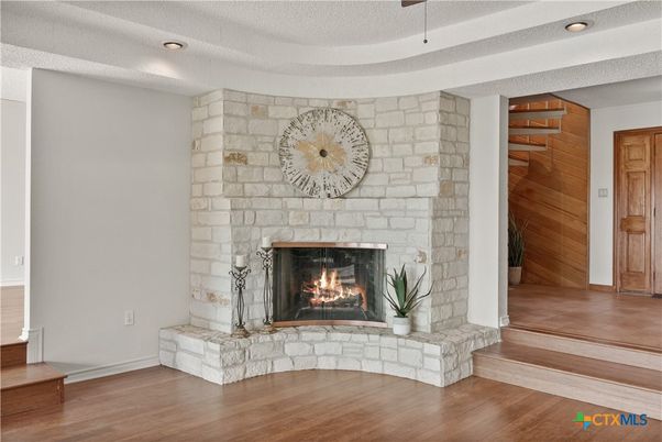 Fireplace, Interior, Recessed Lighting, Stone Walls, Wood Texture Flooring