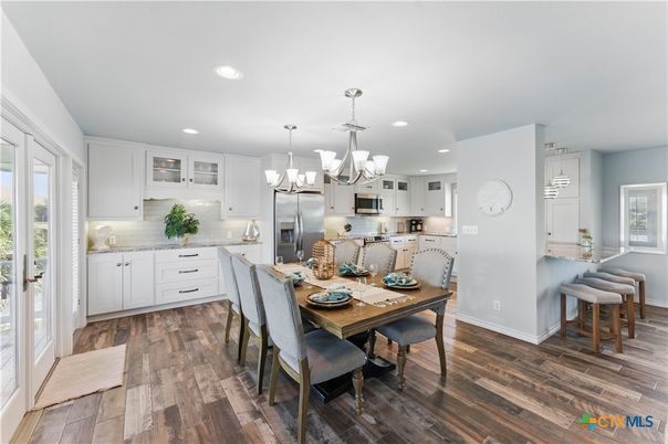 Chandelier, Dining room, Interior, Kitchen, Pendant Lights, Recessed Lighting, Stainless Steel Appliances, Wood Texture Flooring