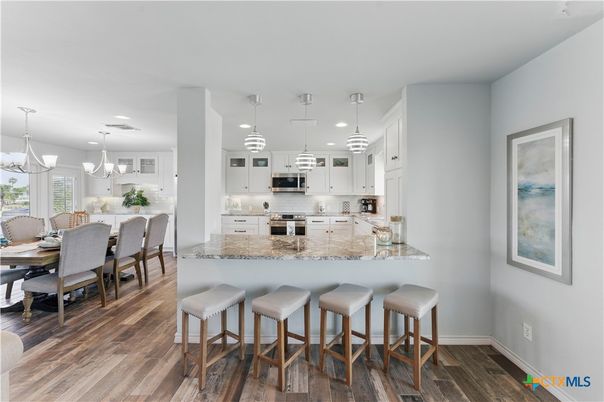 Dining room, Interior, Kitchen, Pendant Lights, Recessed Lighting, Stainless Steel Appliances, Wood Texture Flooring