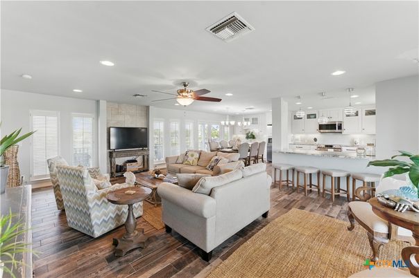 Dining room, Fireplace, Interior, Kitchen, Living room, Pendant Lights, Recessed Lighting, Stainless Steel Appliances, Stone Walls, Wood Texture Flooring