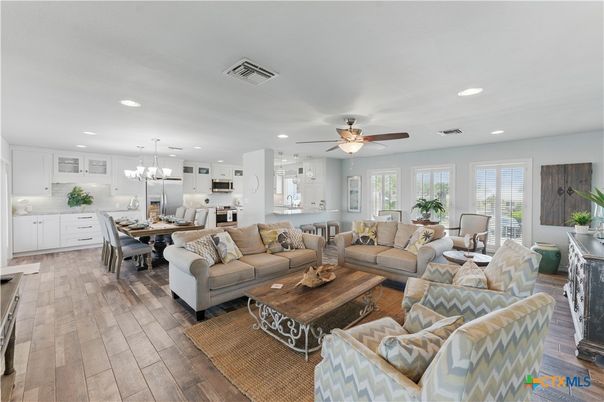 Chandelier, Dining room, Interior, Kitchen, Living room, Pendant Lights, Recessed Lighting, Stainless Steel Appliances, Wood Texture Flooring
