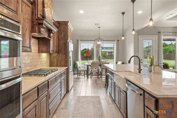Dining room, Interior, Kitchen, Pendant Lights, Recessed Lighting, Stainless Steel Appliances, Wood Texture Flooring