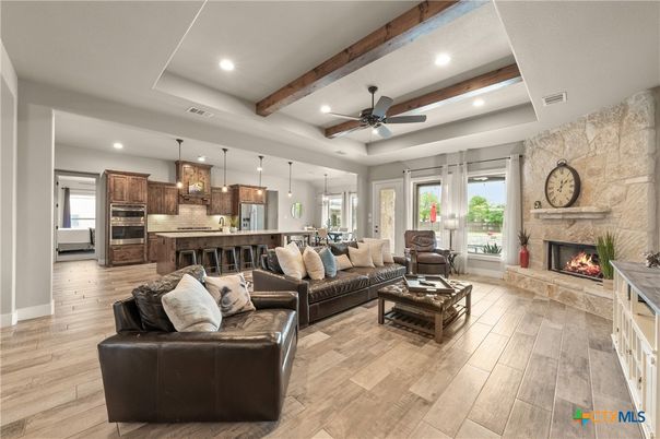 Fireplace, Interior, Kitchen, Living room, Pendant Lights, Recessed Lighting, Stainless Steel Appliances, Stone Walls, Wooden Beams, Wood Texture Flooring