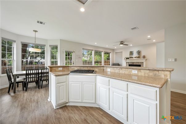 Dining room, Fireplace, Interior, Pendant Lights, Recessed Lighting, Wood Texture Flooring