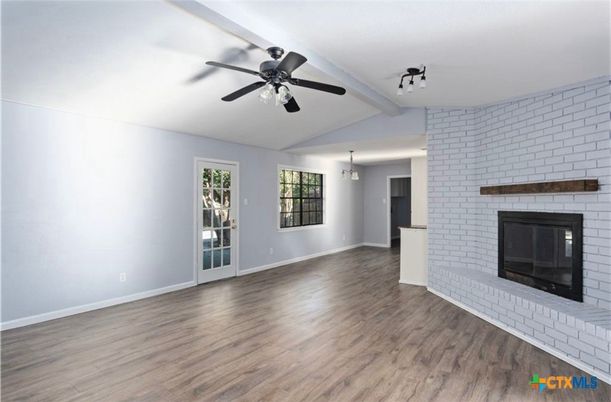 Empty room, Fireplace, Interior, Pendant Lights, Stone Walls, Wood Texture Flooring