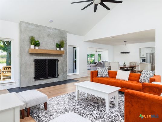 Dining room, Fireplace, Interior, Kitchen, Living room, Pendant Lights, Stainless Steel Appliances, Wood Texture Flooring