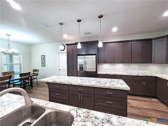 Chandelier, Dining room, Interior, Kitchen, Pendant Lights, Recessed Lighting, Stainless Steel Appliances, Wood Texture Flooring